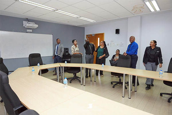Photo 3: Minister Benjamin tours one of the conference rooms at SAPA, engaging with staff and stakeholders as part of her official site visit focused on facility maintenance, upgrades, and long-term development planning on Tuesday July 15, 2025.
