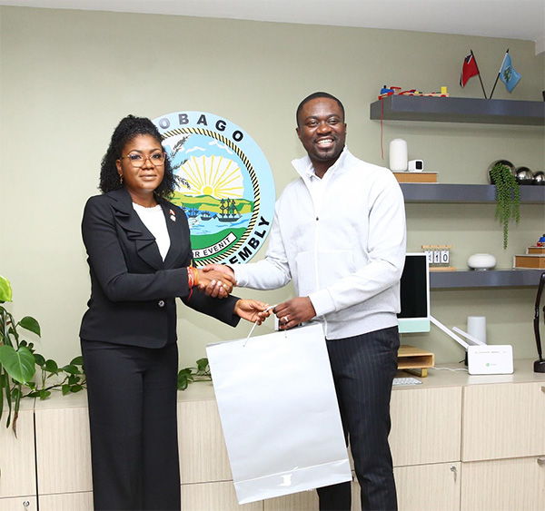 Photo 2: The Honourable Michelle Benjamin, Minister of Culture and Community Development presents the Honourable Farley Augustine, Chief Secretary of the Tobago House of Assembly with a token during her official visit to the Office of the Chief Secretary – THA on July 10, 2025.