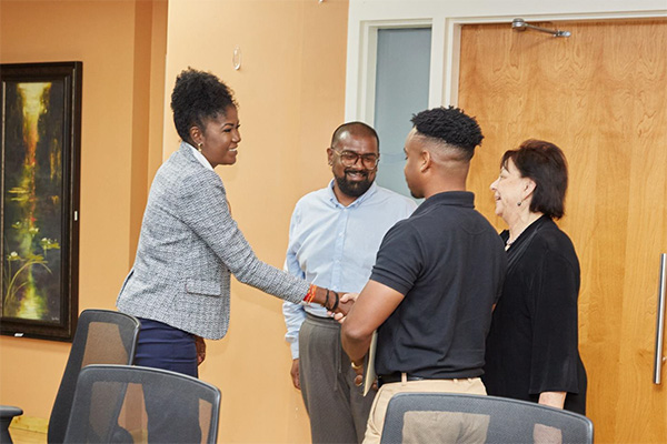 Photo 2: The Honourable Michelle Benjamin, Minister of Culture and Community Development, greets Mr. Mark Ayen, President of the Trinidad and Tobago Carnival Bands Association (TTCBA), Dr. Rosalind Gabriel, Vice President, TTCBA, and Mr. Valmiki Maharaj, Public Relations Officers, TTCBA.