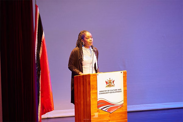 Photo 2: Ms. Joy Benjamin, Programme Coordinator at the Ministry of Culture and Community Development, Community Development Division, shares opening remarks at the Trailblazers: National Youth Apprenticeship Community Development Programme 2025, registration and orientation session held at SAPA on July 28, 2025.
