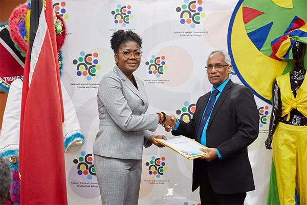 Photo 2: The Honourbale Michelle Benjamin, Minister of Culture and Community Development presents Mr. Peter Kanhai, with his instrument of Appointment as Chairman of the National Carnival Commission of Trinidad and Tobago at the Ministry’s headquarters on Wednesday July 16, 2025.